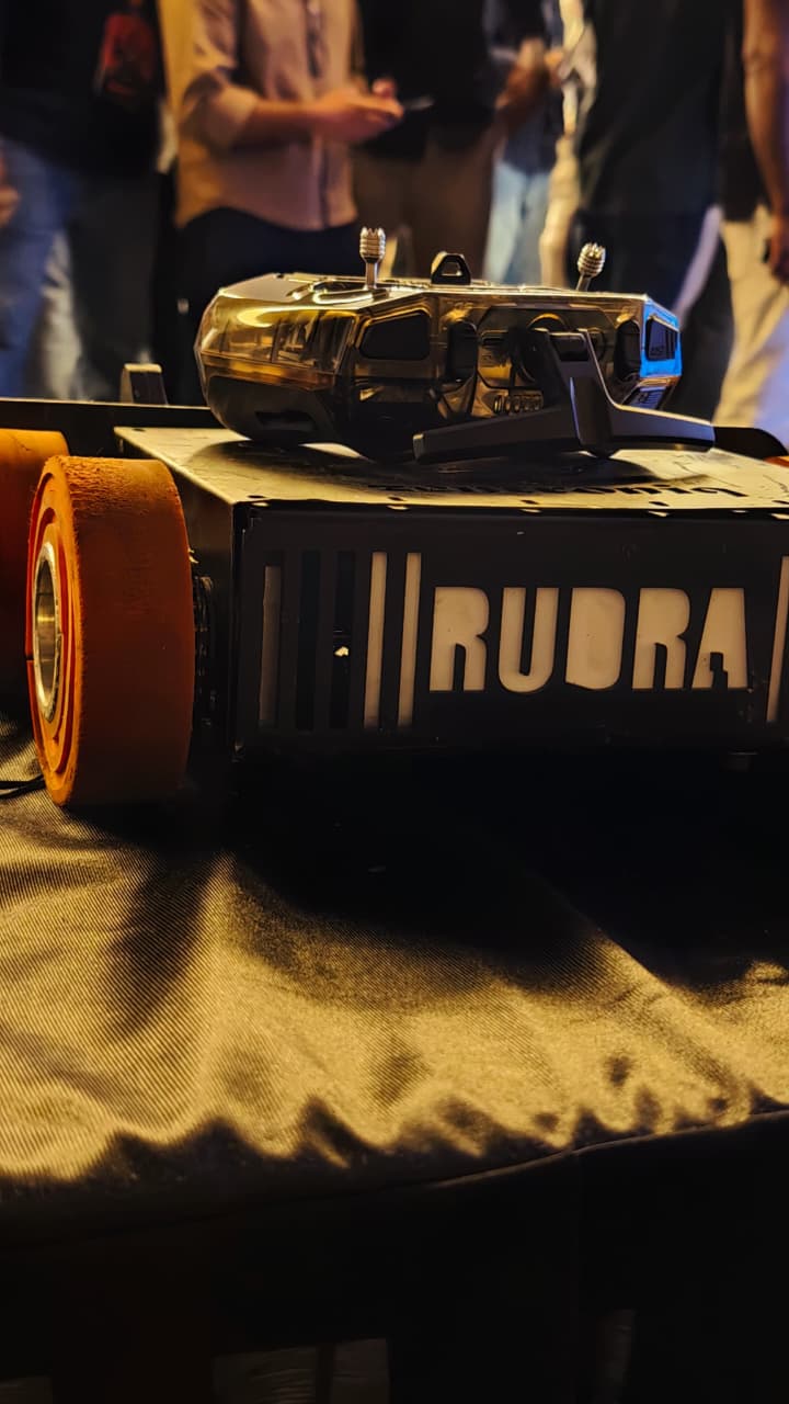 Zentroniq Robo Soccer competition with autonomous robots playing soccer on a green pitch